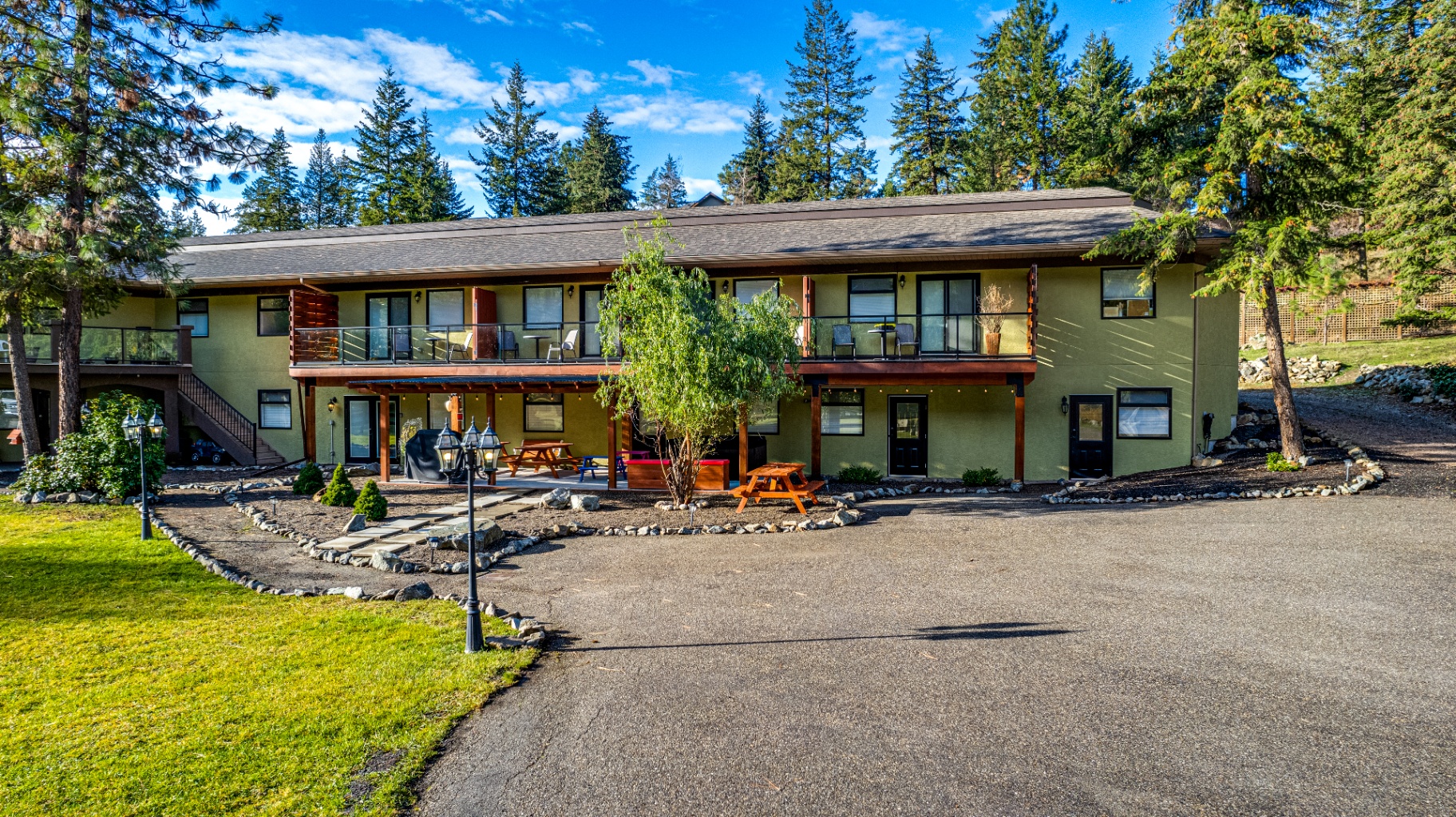 Property exterior with outdoor patio and landscaping