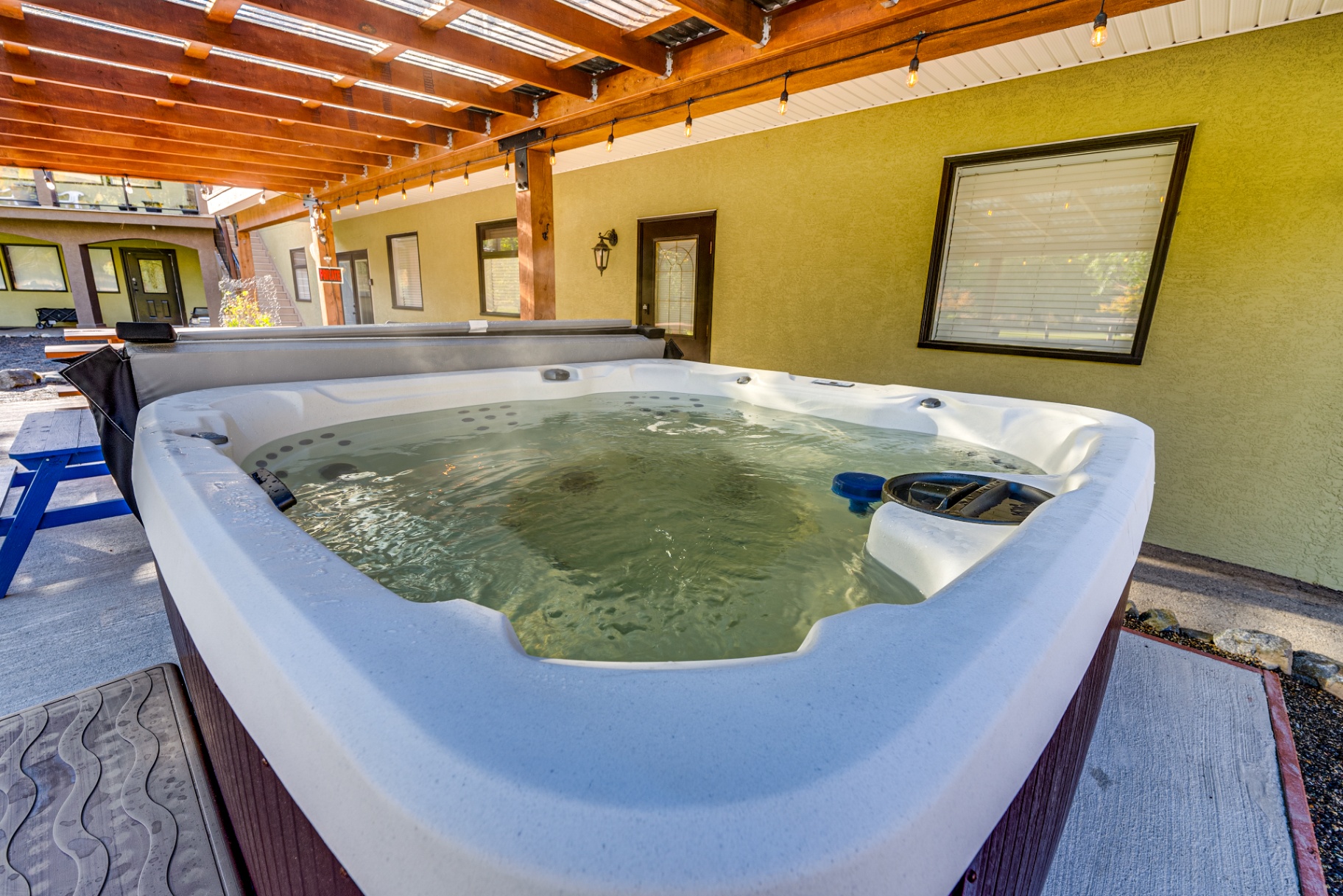 Hot tub relaxation area with scenic mountain backdrop