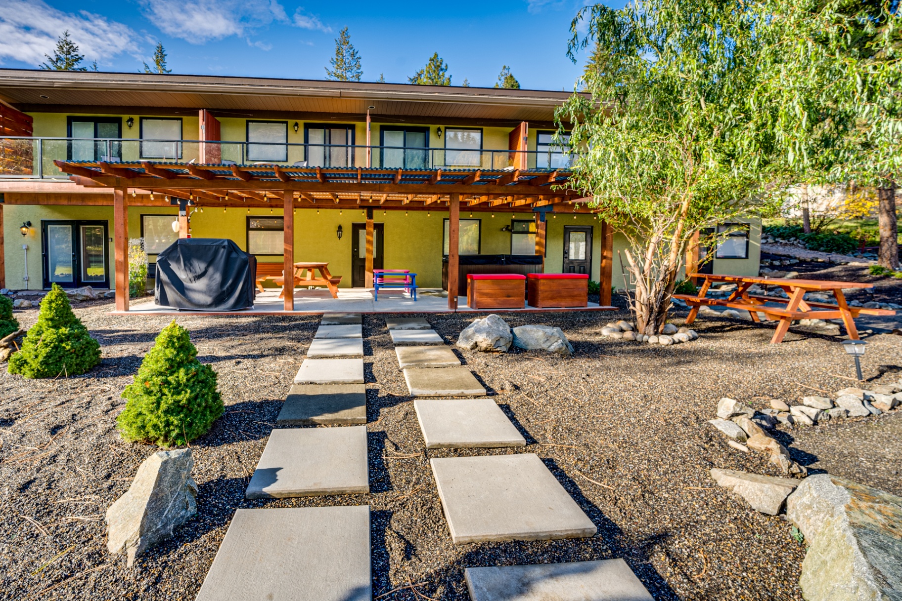 Exterior walkway with beautiful landscaping and stepping stones