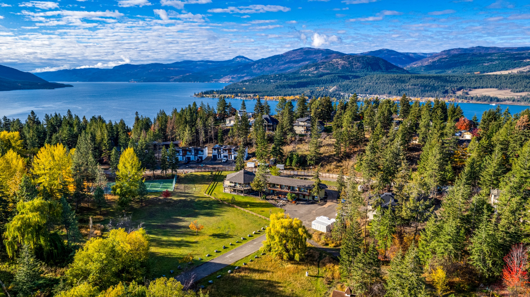 Aerial view of The Haven with Okanagan Lake and mountains