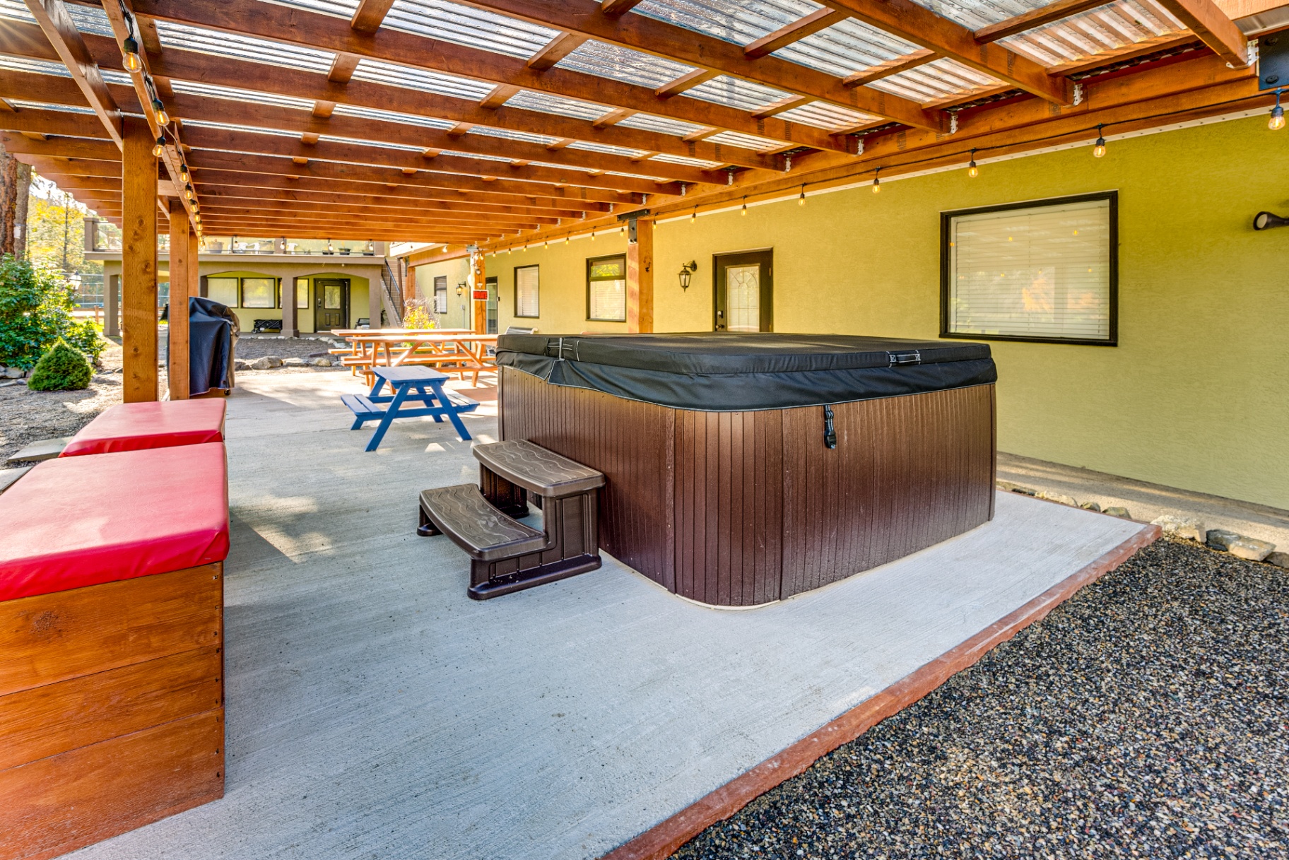 Luxury hot tub with outdoor dining and relaxation area