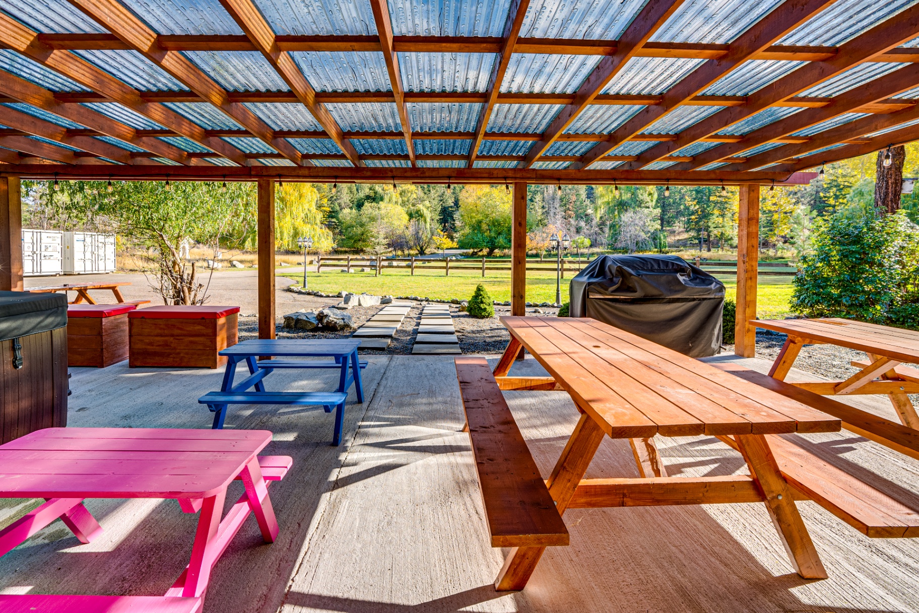 Colorful outdoor dining area with vibrant picnic tables