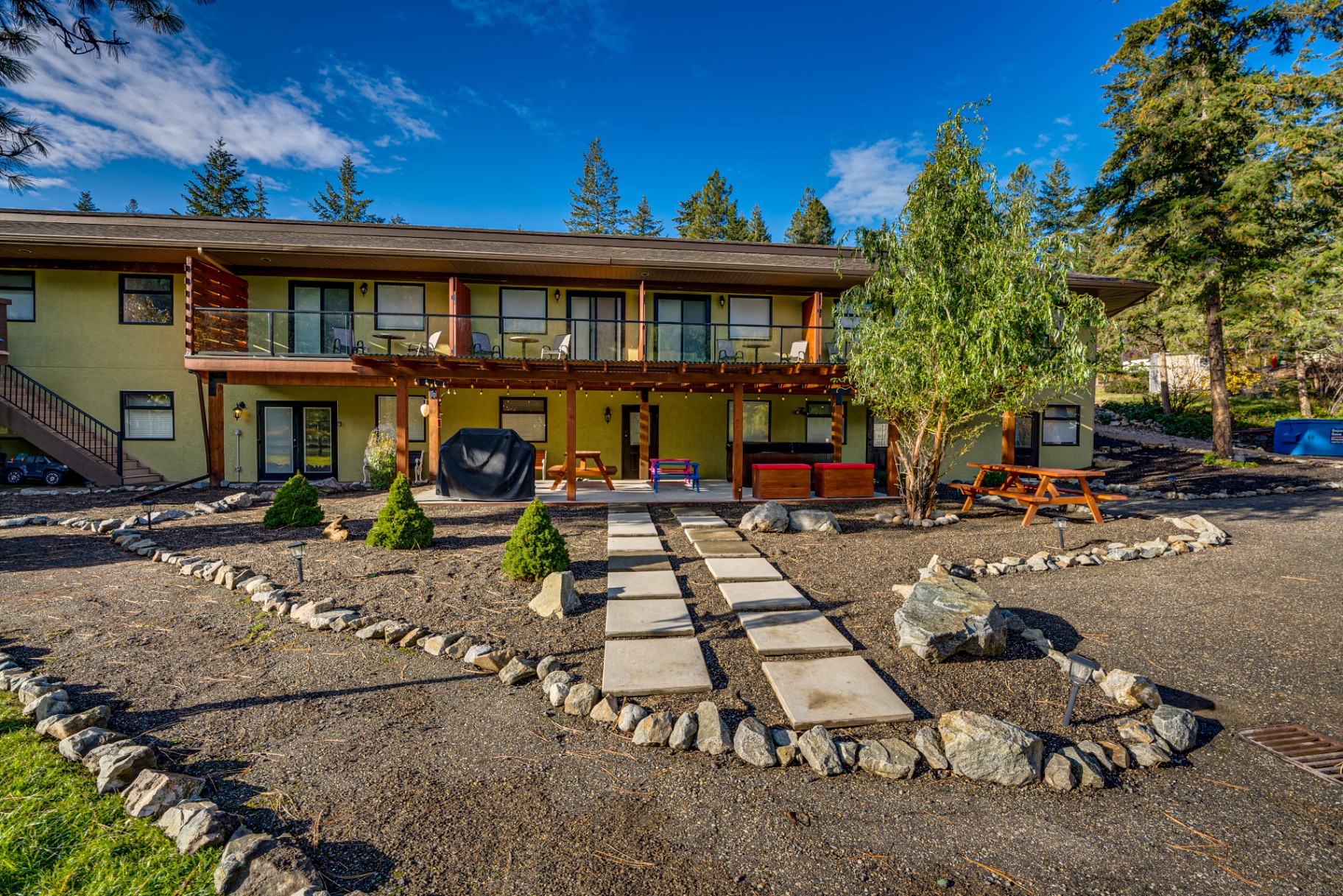 Front view of building with covered patio and outdoor dining areas